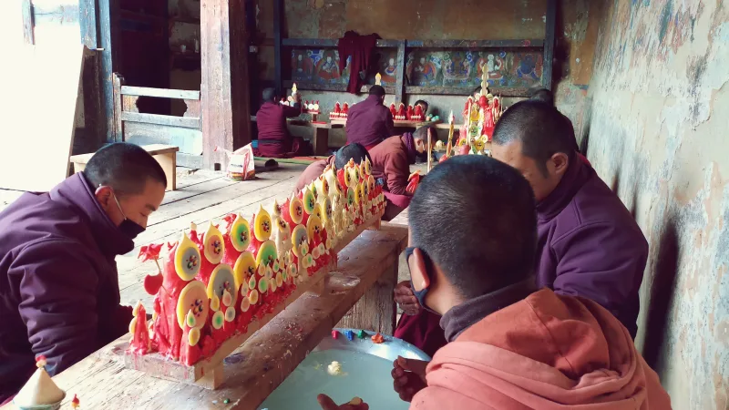 Monks preparing Butter cakes offering at Tamshing Monastery at Bumthang