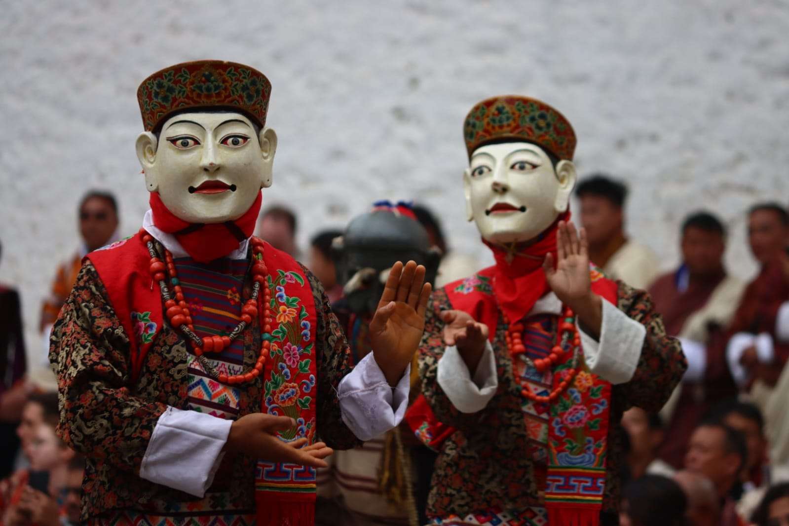 masked dancers performing at the Punakha Tshechu