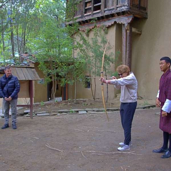 Couple from Australia trying archery in Bhutan