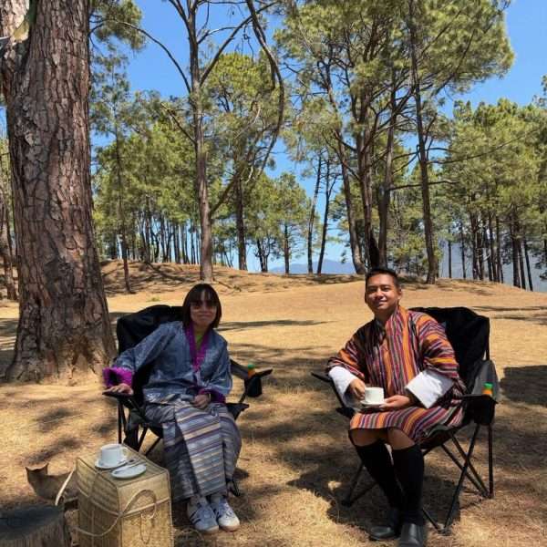 Solo female traveler from Luxembourg having a tea break in the woods
