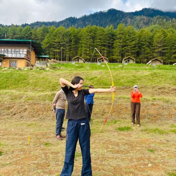Group of family friends from United Kingdom trying archery in Bhutan